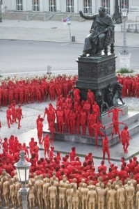 Participants get into position for photographer Spencer Tunick's Ring installation